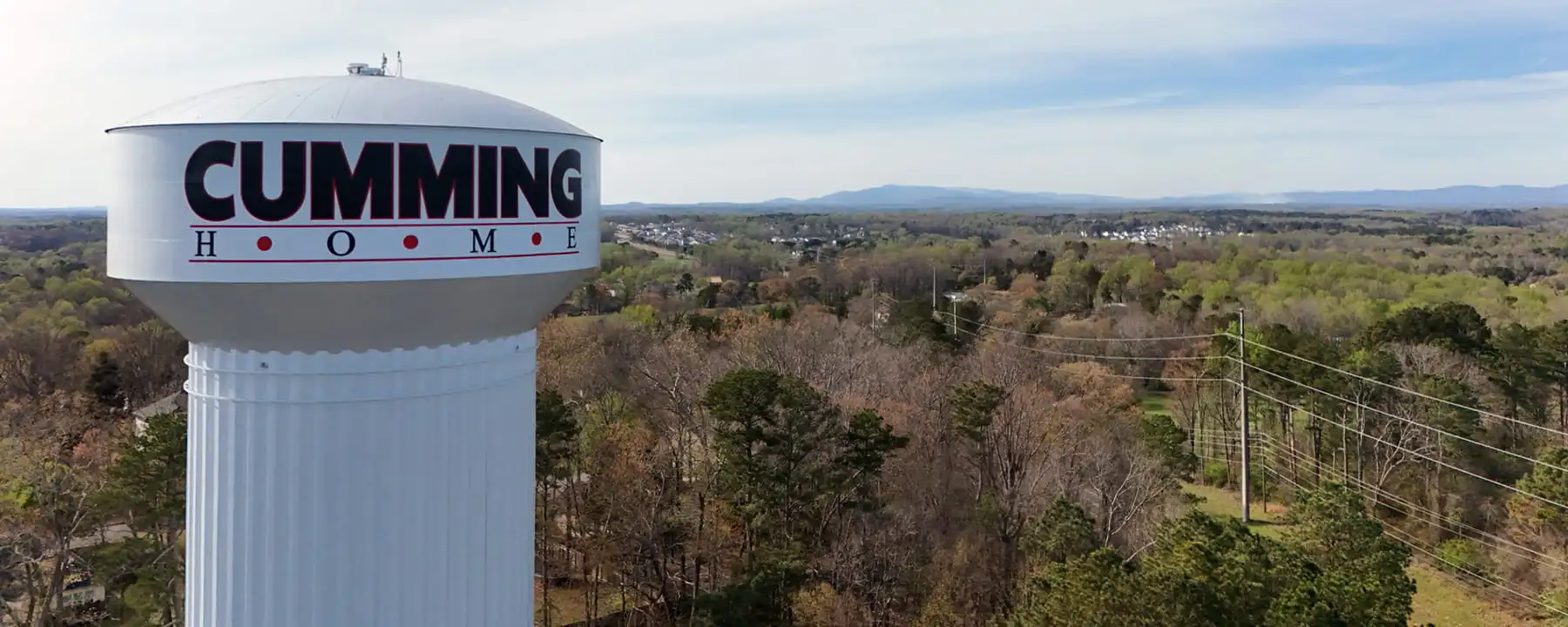 Aerial view of the Cumming, Georgia water tower with mountain backdrop, representing an SEO company Cumming G businesses can trust for local online visibility